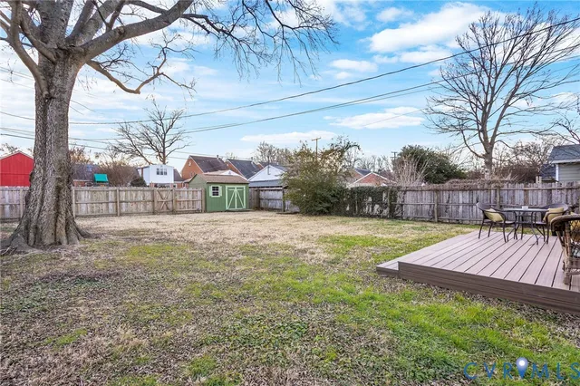 a front view of house with yard outdoor seating and barbeque oven