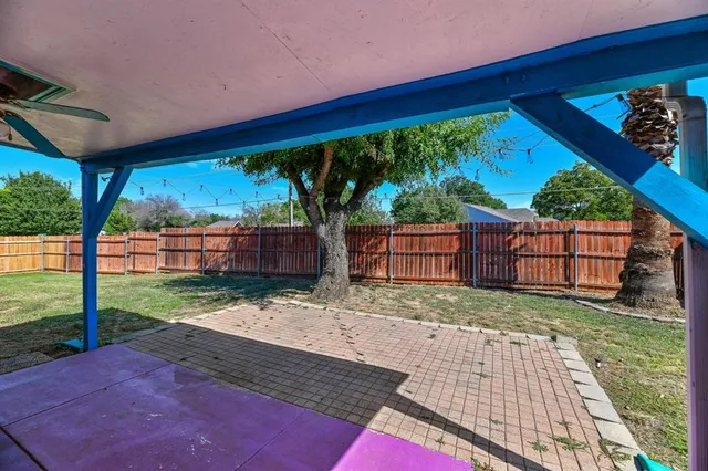 a view of a backyard with wooden floor and roof