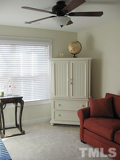 7641 Weathered Oak Way Raleigh, NC 27616 - Photo 15 of 20 a living room with furniture a window and a ceiling fan