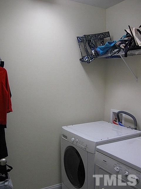 7641 Weathered Oak Way Raleigh, NC 27616 - Photo 18 of 20 a utility room with dryer and washer