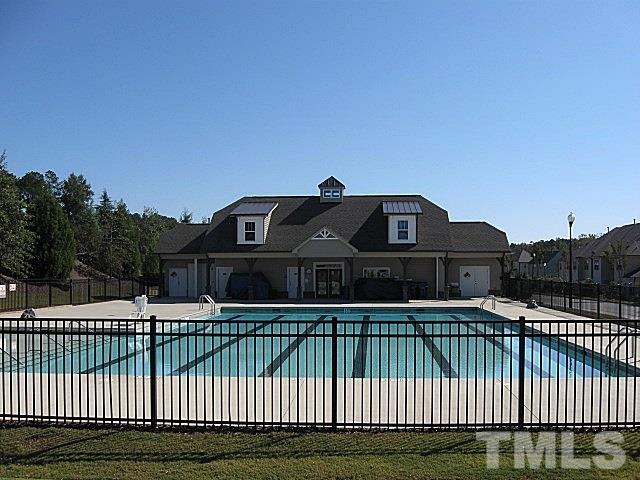 7641 Weathered Oak Way Raleigh, NC 27616 - Photo 19 of 20 a front view of a house with a yard