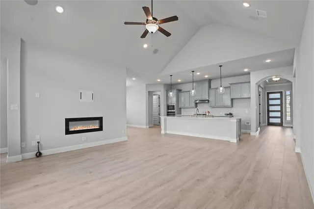 a kitchen with stainless steel appliances granite countertop a stove and a microwave