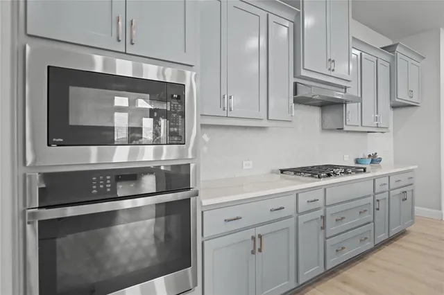 a view of a livingroom with a ceiling fan and window