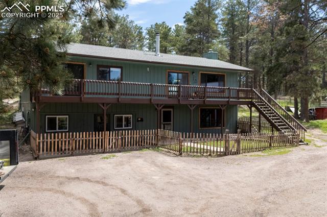 18085 Table Rock Road Colorado Springs, CO 80908 - Photo 1 of 46 Welcome! Small picket fence goes around the main yard.