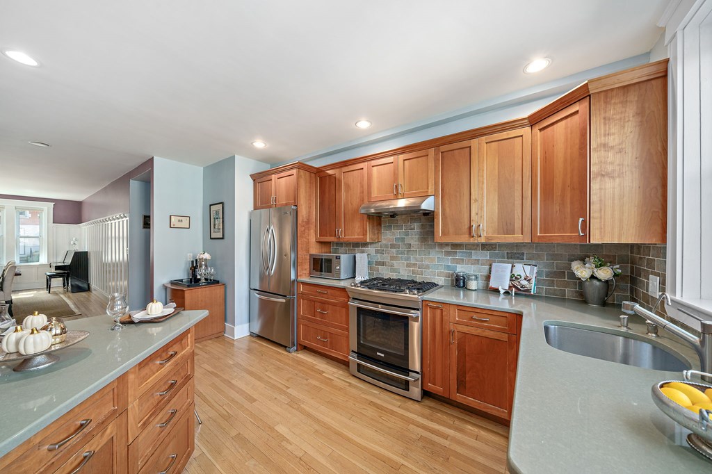 23 Claflin Road, Unit 1 Brookline, MA 02445 - Photo 11 of 41 a kitchen with stainless steel appliances a sink stove and refrigerator