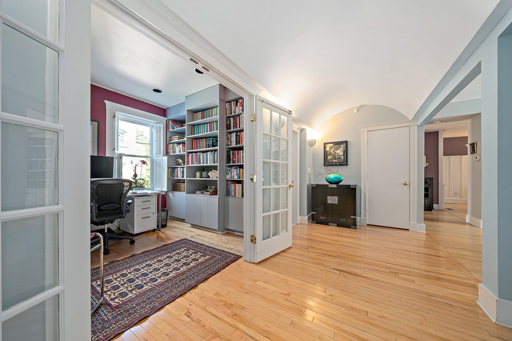 23 Claflin Road, Unit 1 Brookline, MA 02445 - Photo 18 of 41 a room with furniture and a book shelf