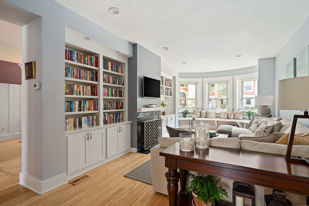 23 Claflin Road, Unit 1 Brookline, MA 02445 - Photo 2 of 41 a living room with furniture a rug and a flat screen tv