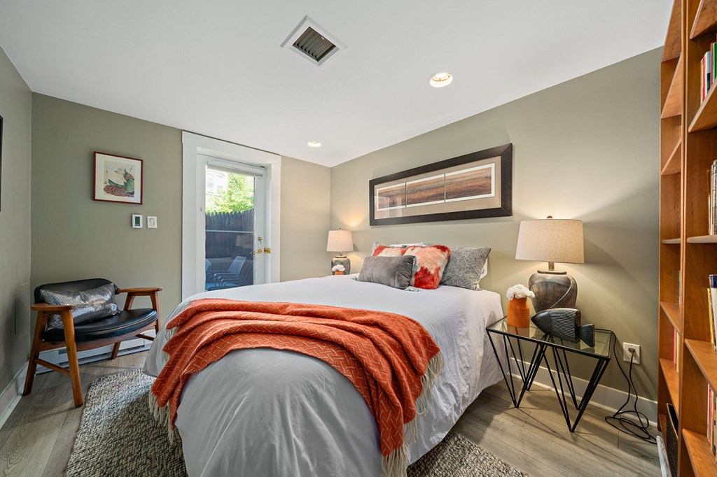 23 Claflin Road, Unit 1 Brookline, MA 02445 - Photo 26 of 41 a bedroom with a bed and wooden floor