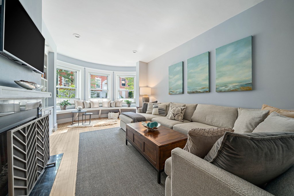 23 Claflin Road, Unit 1 Brookline, MA 02445 - Photo 3 of 41 a living room with furniture and a fireplace