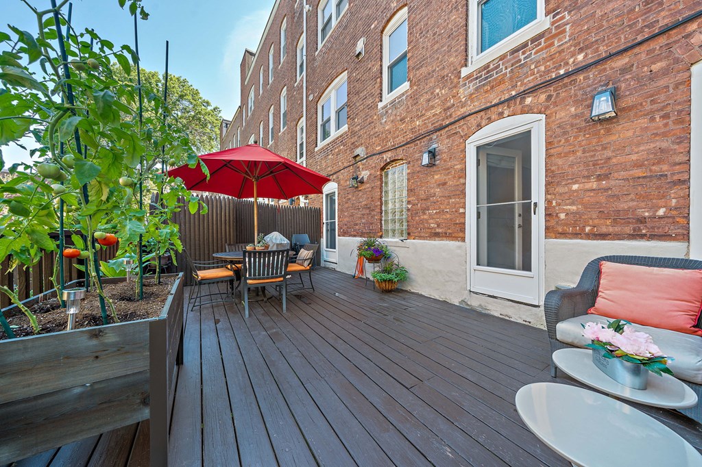 23 Claflin Road, Unit 1 Brookline, MA 02445 - Photo 32 of 41 a patio with wooden table and chairs