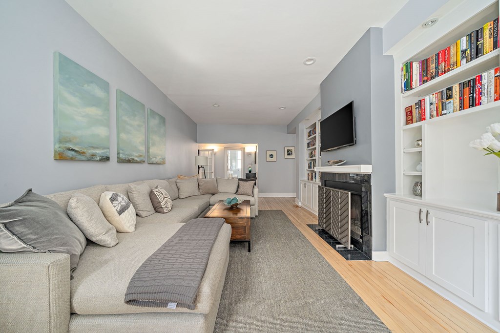 23 Claflin Road, Unit 1 Brookline, MA 02445 - Photo 5 of 41 a living room with furniture and a fireplace
