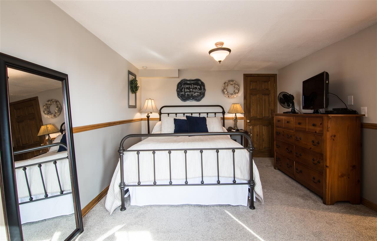 5772 East Timber Ridge Road Mount Crawford, VA 22841 - Photo 25 of 50 a bedroom with furniture and flat screen tv