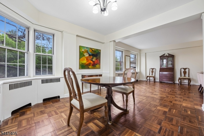 10 Crestmont Road, Unit 2N Montclair, NJ 07042 - Photo 6 of 25 a view of a livingroom with furniture and a dining table chair