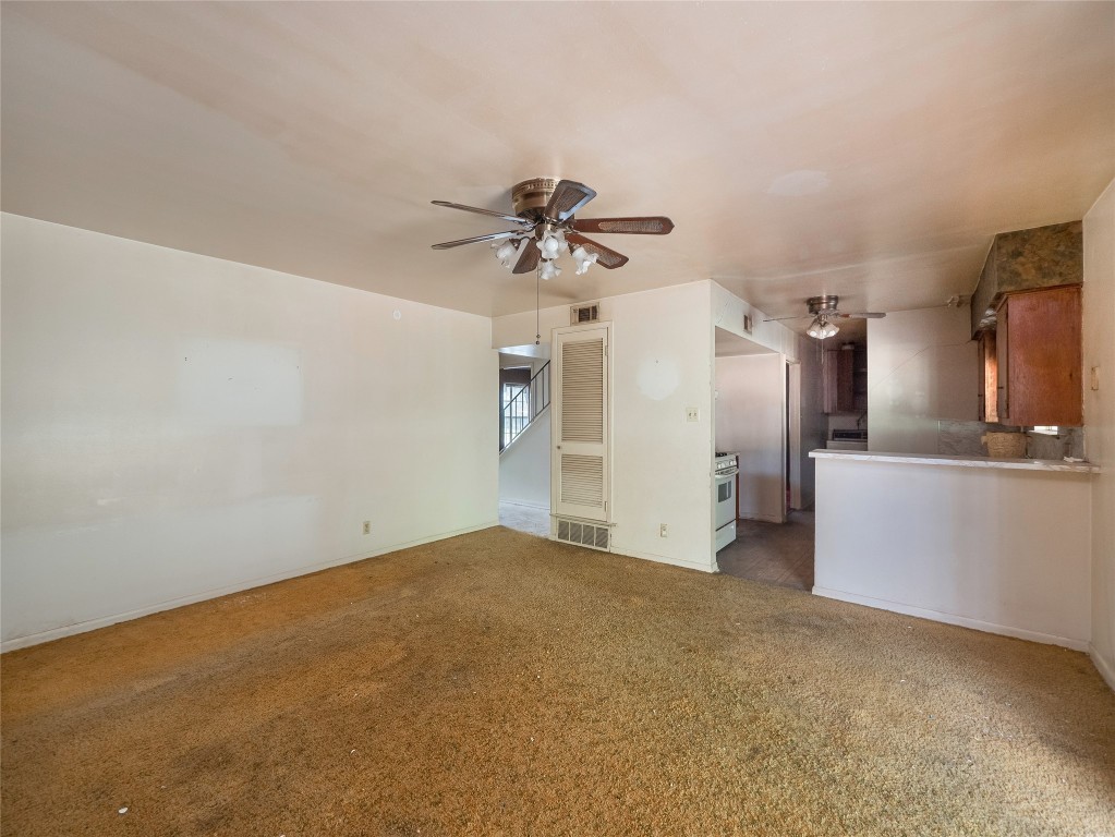 401 Ramble Lane Austin, TX 78745 - Photo 5 of 32 a view of a kitchen with a sink and a refrigerator