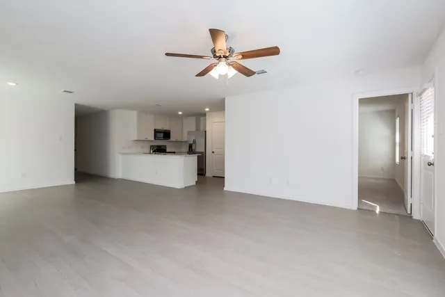 a view of a kitchen with a sink and cabinets