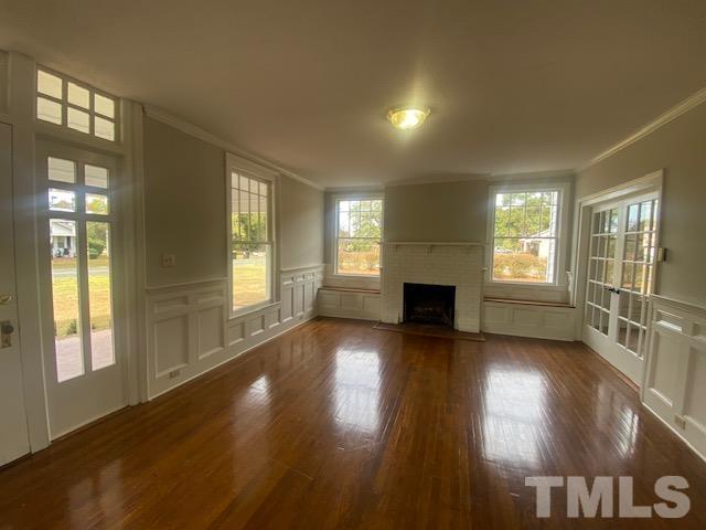 164 Jernigan Road Dunn, NC 28334 - Photo 14 of 30 a view of a livingroom with wooden floor and a fireplace