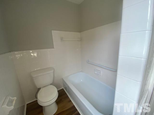 164 Jernigan Road Dunn, NC 28334 - Photo 23 of 30 a white toilet sitting next to a shower