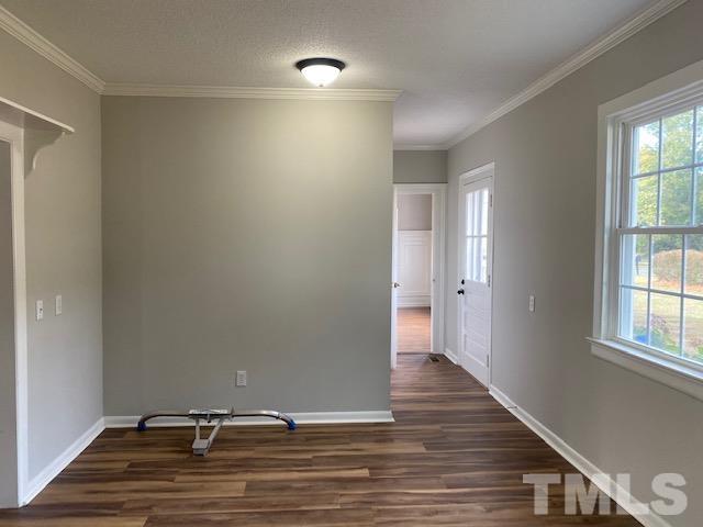 164 Jernigan Road Dunn, NC 28334 - Photo 10 of 30 a view of room with window and wooden floor