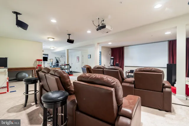 a bathroom with a granite countertop sink mirror vanity and toilet