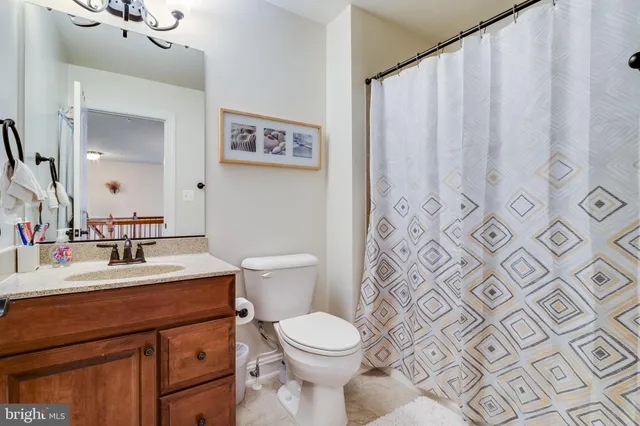 a spacious bedroom with a bed and a window