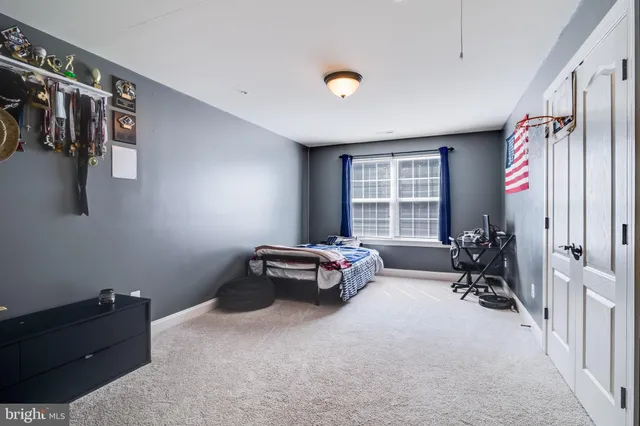 a bedroom with a bed and cabinets