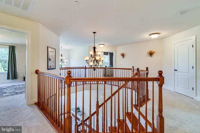 a view with a double vanity sink mirror and window