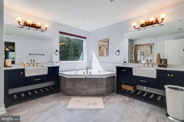 a bathroom with a shower a sink a mirror and a shower