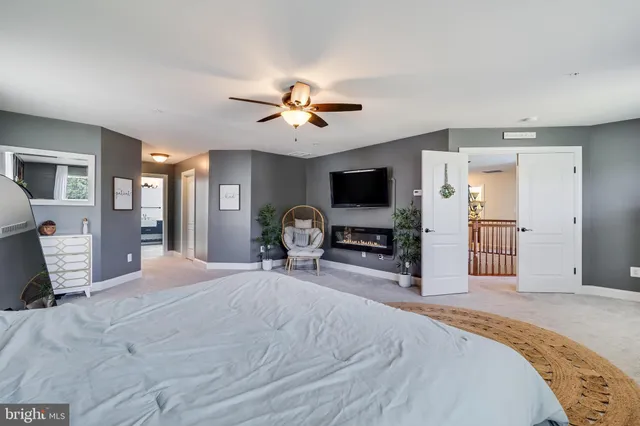 a view of backyard with outdoor seating and plants