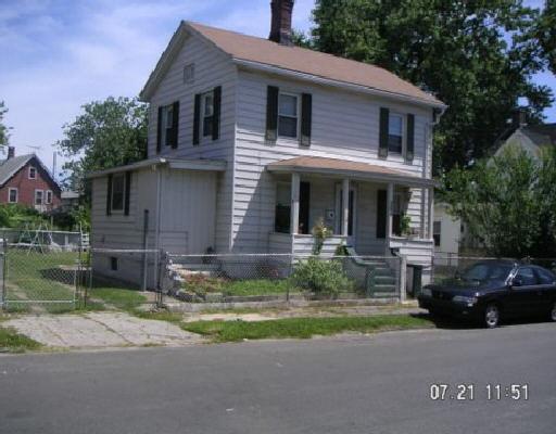 259 Eagle Street Bridgeport, CT 06607 - Photo 1 of 1 a view of a house with a yard