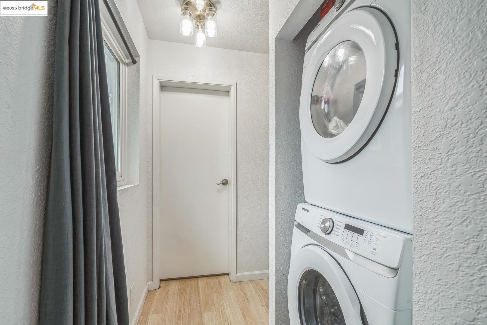874 Pine Street Oakland, CA 94607 - Photo 20 of 32 a view of a hallway with washer and dryer