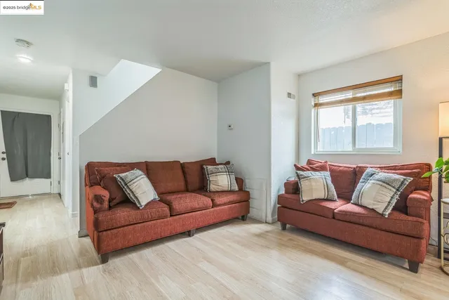 a living room with a couch and a window