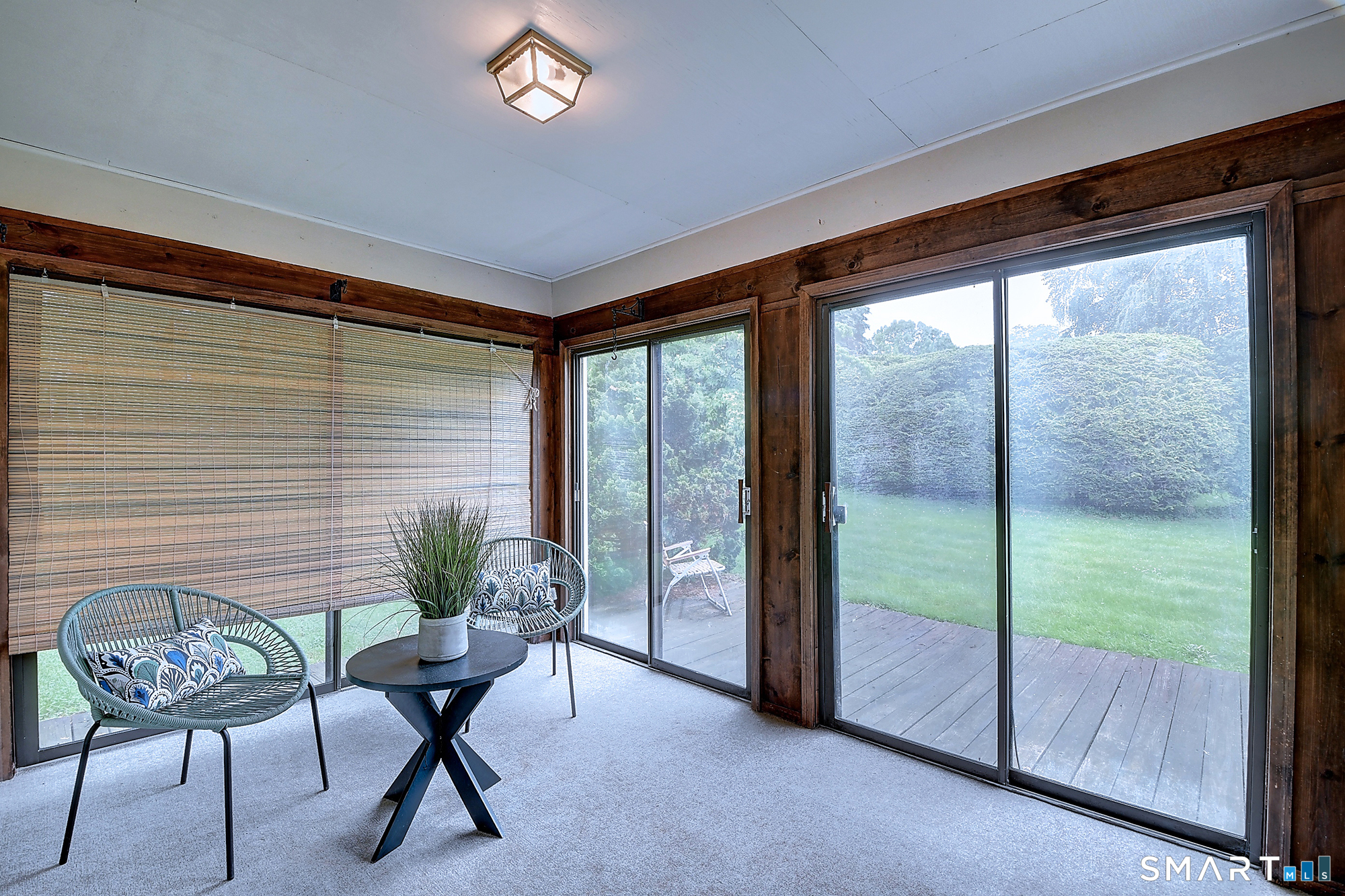 80 Grist Mill Road Wethersfield, CT 06109 - Photo 24 of 40 a living room with furniture and a floor to ceiling window