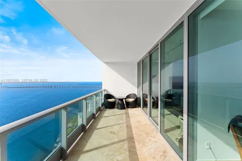 a hallway with a room and pool table