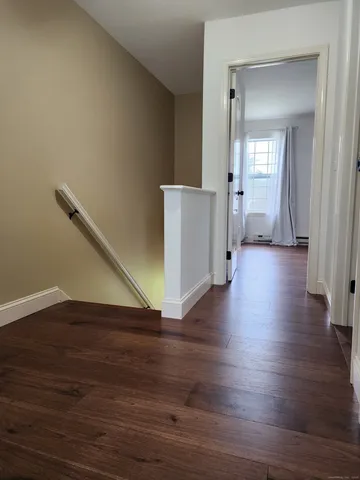 a view of a livingroom with wooden floor