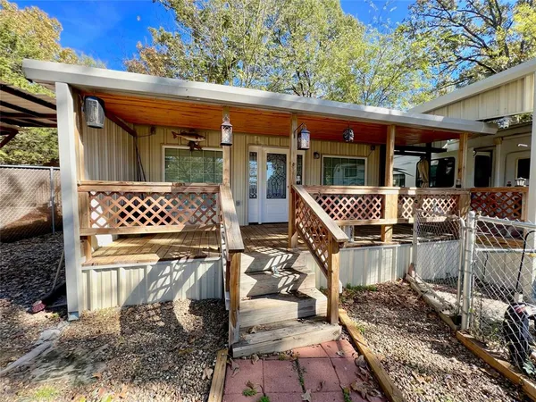 a front view of a house with a large window