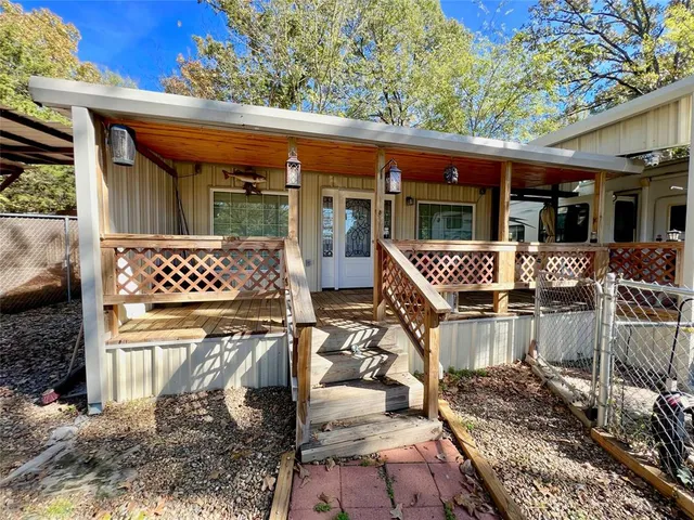 a front view of a house with a large window