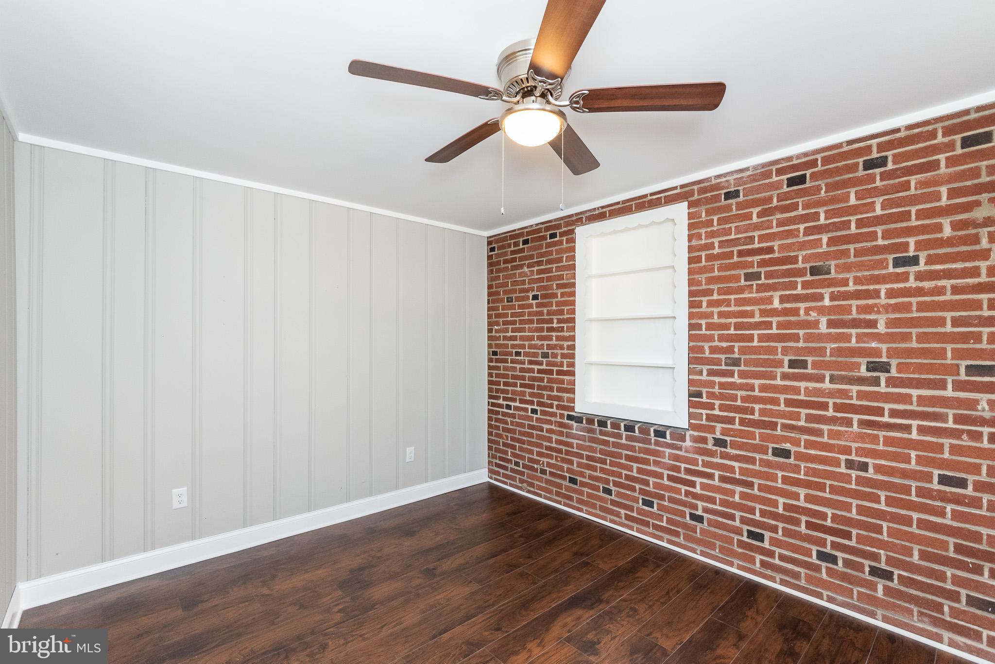 3040 Parktowne Road Baltimore, MD 21234 - Photo 19 of 50 Brick Accent Wall offers nice dimension