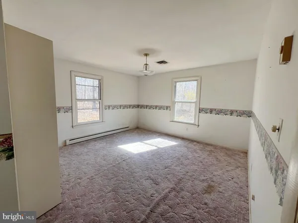 an empty room with windows