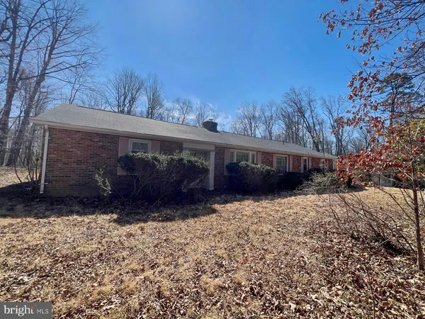 a view of a pathway in front of house