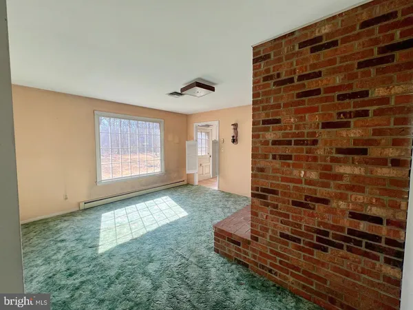 a view of an empty room and window