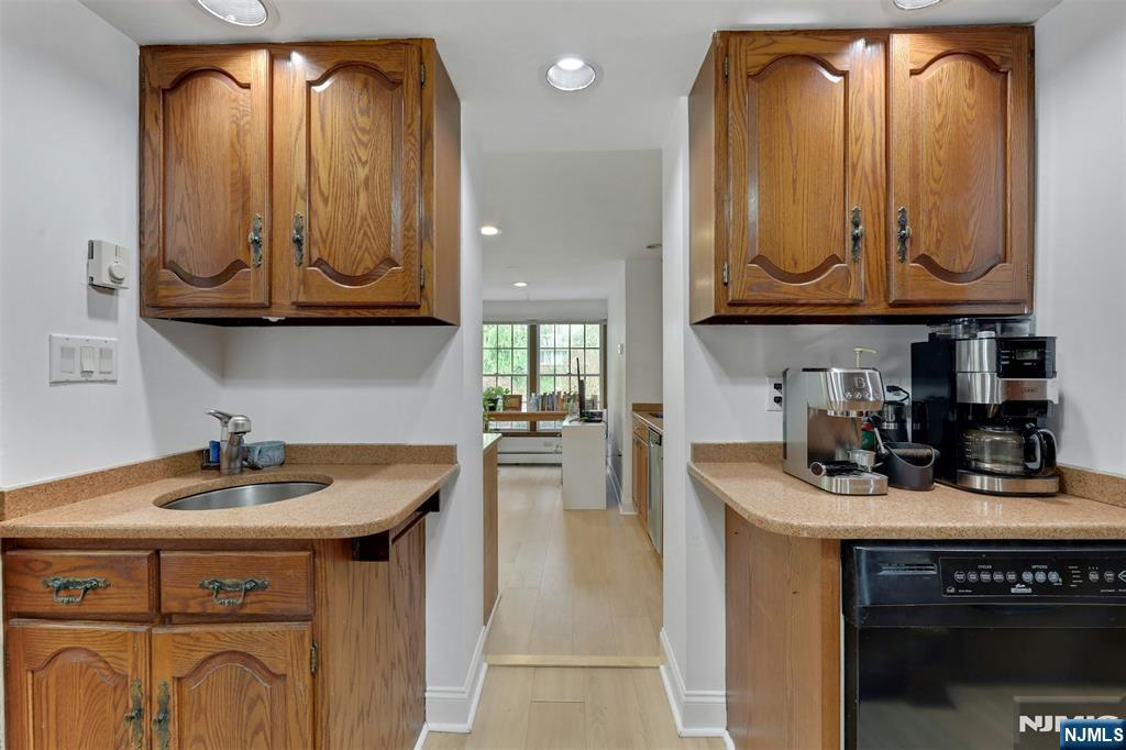 1280 Sussex Road Teaneck, NJ 07666 - Photo 12 of 36 a kitchen with stainless steel appliances granite countertop a sink a stove and cabinets