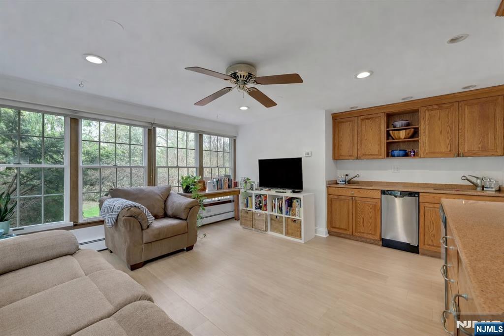 1280 Sussex Road Teaneck, NJ 07666 - Photo 13 of 36 a living room with furniture and a flat screen tv