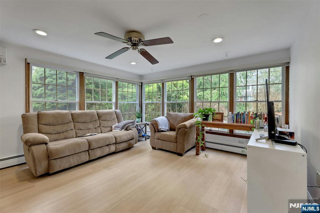 1280 Sussex Road Teaneck, NJ 07666 - Photo 14 of 36 a living room with furniture and a large window