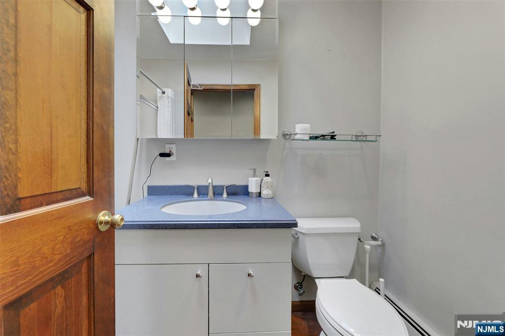 1280 Sussex Road Teaneck, NJ 07666 - Photo 18 of 36 a bathroom with a sink and a toilet
