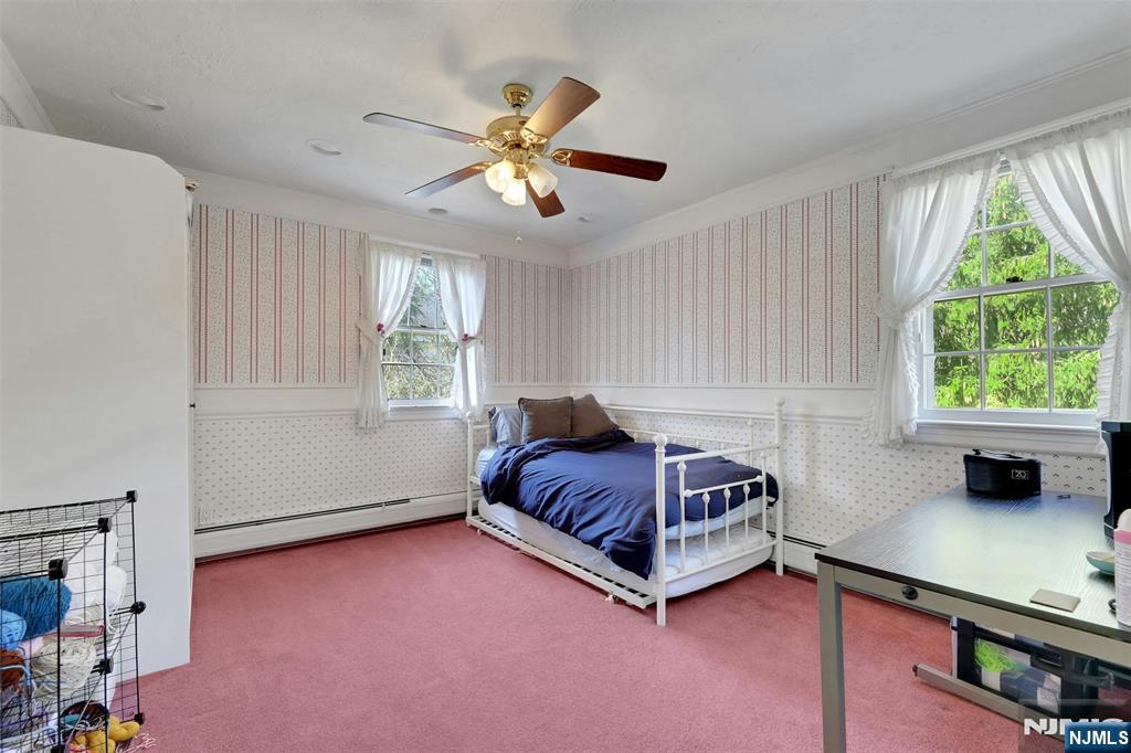 1280 Sussex Road Teaneck, NJ 07666 - Photo 19 of 36 a living room with a bed furniture and a window