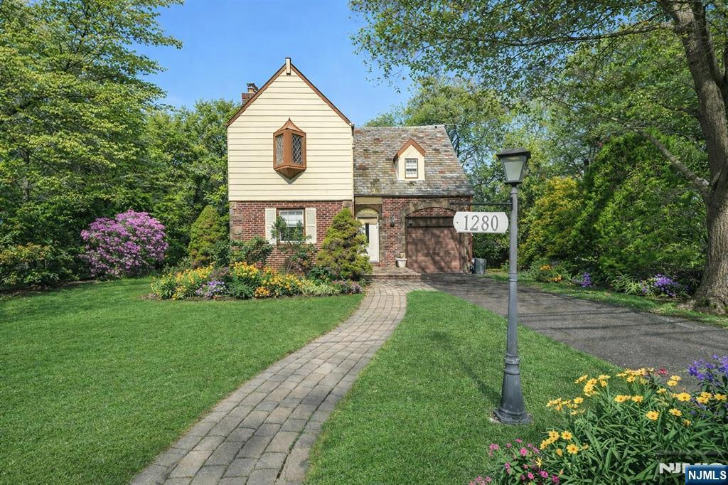 1280 Sussex Road Teaneck, NJ 07666 - Photo 2 of 36 a front view of a house with garden