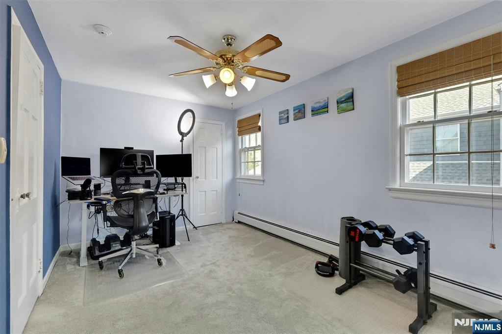 1280 Sussex Road Teaneck, NJ 07666 - Photo 21 of 36 a view of a workspace with furniture and a window