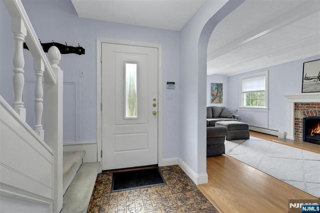 1280 Sussex Road Teaneck, NJ 07666 - Photo 3 of 36 a view of a livingroom with furniture and a fireplace