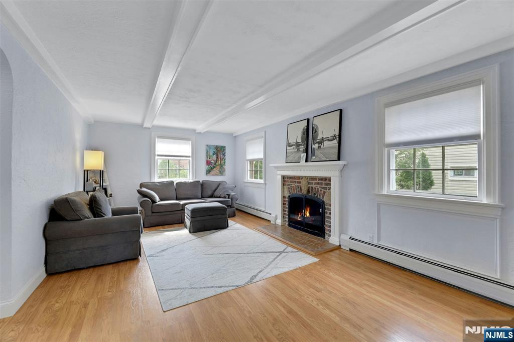 1280 Sussex Road Teaneck, NJ 07666 - Photo 4 of 36 a living room with furniture and a fireplace
