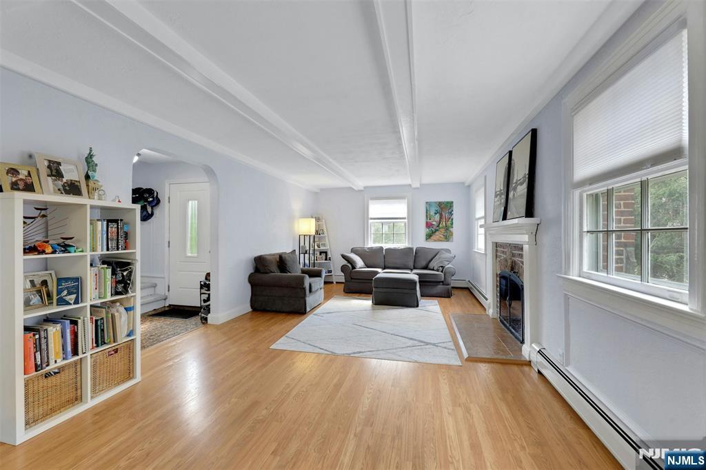 1280 Sussex Road Teaneck, NJ 07666 - Photo 5 of 36 a living room with furniture and a book shelf
